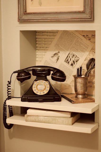 Vintage telephone on kitchen shelf