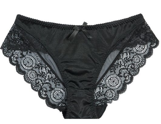 Lingerie noire élégante sur fond neutre